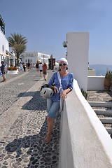 Image showing Greek woman on the streets of Oia, Santorini, Greece