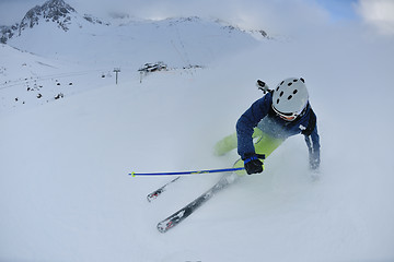 Image showing skiing on fresh snow at winter season at beautiful sunny day