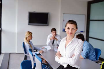 Image showing business woman with her staff in background at office