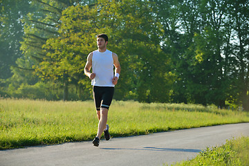 Image showing Young couple jogging at morning