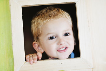 Image showing happy child in a window