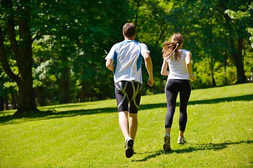 Image showing Young couple jogging