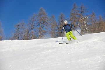 Image showing skiing on fresh snow at winter season at beautiful sunny day