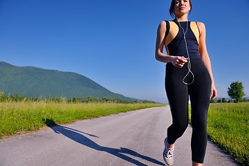 Image showing Young beautiful  woman jogging