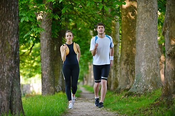 Image showing Young couple jogging