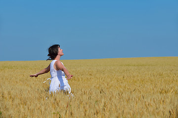 Image showing young woman in wheat field at summer