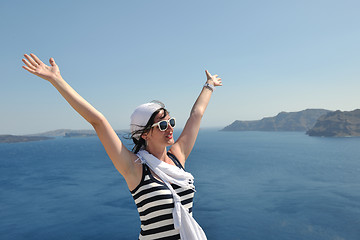 Image showing Greek woman on the streets of Oia, Santorini, Greece