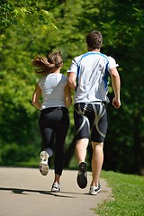 Image showing Young couple jogging at morning