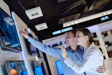 Image showing Young couple in consumer electronics store