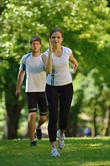 Image showing Young couple jogging