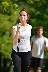 Image showing Young couple jogging at morning