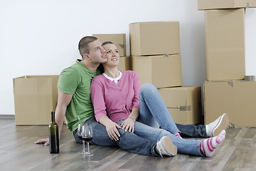 Image showing Young couple moving in new home