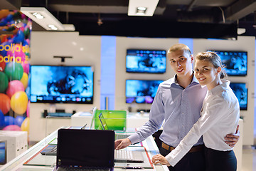 Image showing Young couple in consumer electronics store