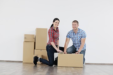 Image showing Young couple moving in new house