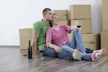 Image showing Young couple moving in new home