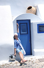 Image showing Greek woman on the streets of Oia, Santorini, Greece