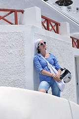 Image showing Greek woman on the streets of Oia, Santorini, Greece