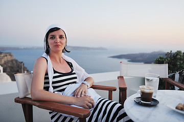 Image showing Greek woman on the streets of Oia, Santorini, Greece