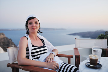 Image showing Greek woman on the streets of Oia, Santorini, Greece