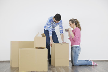 Image showing Young couple moving in new home