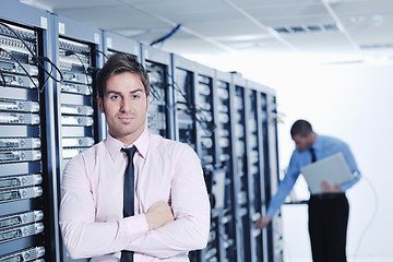 Image showing it enineers in network server room