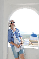 Image showing Greek woman on the streets of Oia, Santorini, Greece