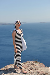 Image showing Greek woman on the streets of Oia, Santorini, Greece