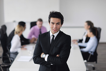 Image showing young business man at meeting