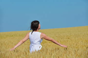 Image showing young woman in wheat field at summer