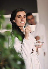 Image showing Young love couple taking fresh morning cup of coffee