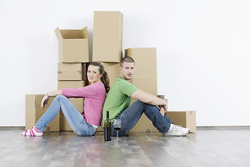 Image showing Young couple moving in new home