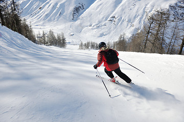 Image showing skiing on fresh snow at winter season at beautiful sunny day