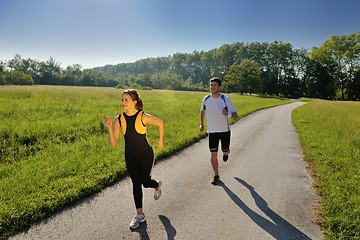 Image showing Young couple jogging