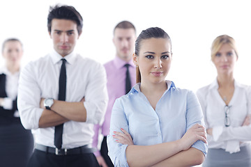 Image showing business woman standing with her staff in background