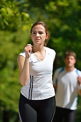 Image showing Young couple jogging at morning