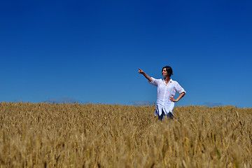 Image showing young woman in wheat field at summer