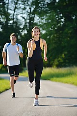 Image showing Young couple jogging at morning