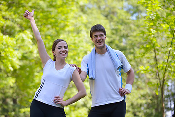 Image showing Couple doing stretching exercise  after jogging