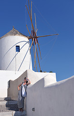 Image showing Greek woman on the streets of Oia, Santorini, Greece