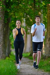 Image showing Young couple jogging