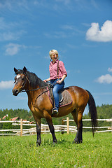 Image showing happy woman  on  horse