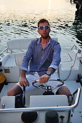 Image showing portrait of happy young man on boat