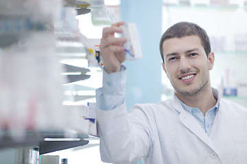 Image showing pharmacist chemist man in pharmacy drugstore