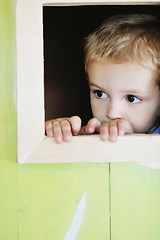 Image showing happy child in a window