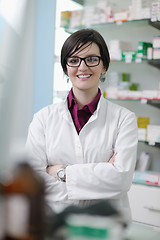 Image showing pharmacist chemist woman standing in pharmacy drugstore