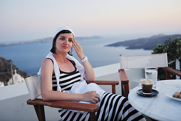 Image showing Greek woman on the streets of Oia, Santorini, Greece