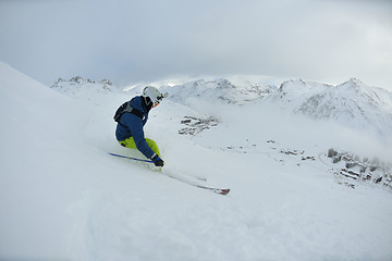 Image showing skiing on fresh snow at winter season at beautiful sunny day