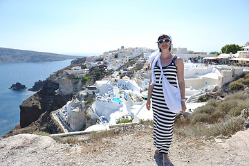 Image showing Greek woman on the streets of Oia, Santorini, Greece