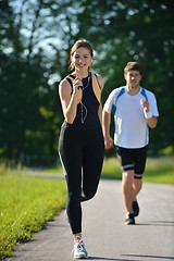 Image showing Young couple jogging