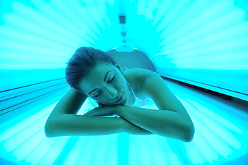 Image showing Beautiful young woman tanning in solarium